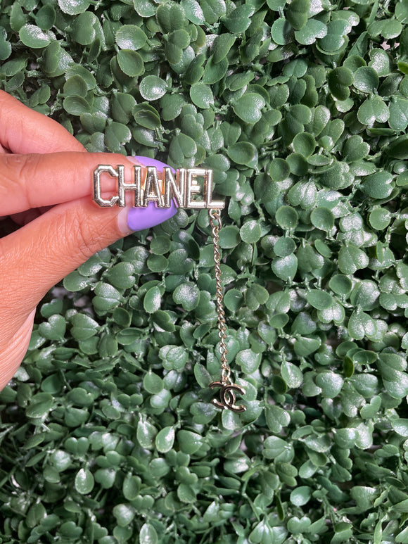 Gold chanel pub with charm